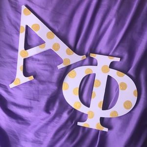 Purple and gold Alpha Phi wooden letters